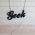 Black geek necklace on a wooden background