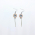 Caffeine dangle bar earrings against a plain white background